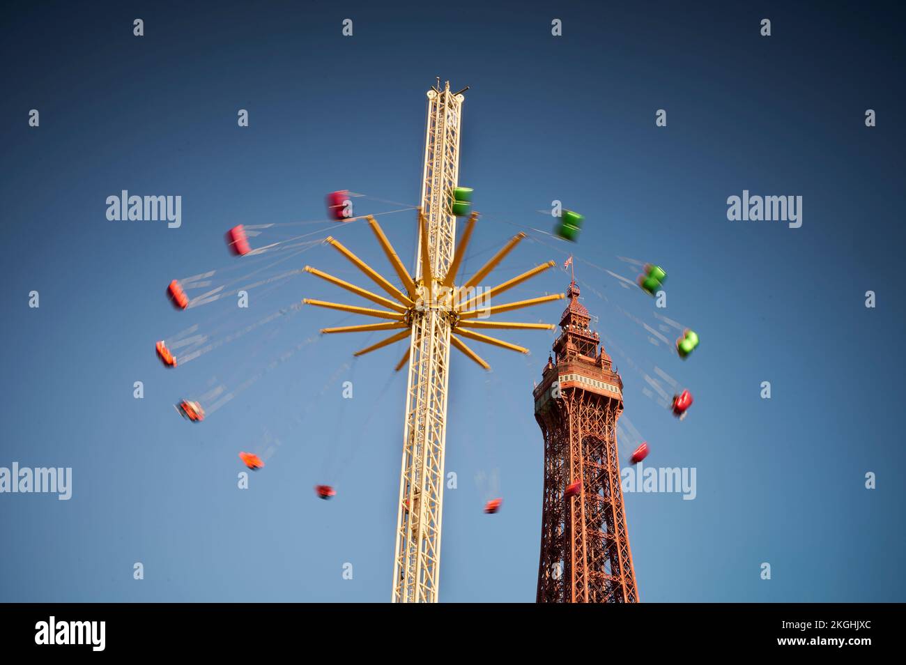 Star Flyer ride with Blackpool Tower in the background on a sunny winter day Stock Photo