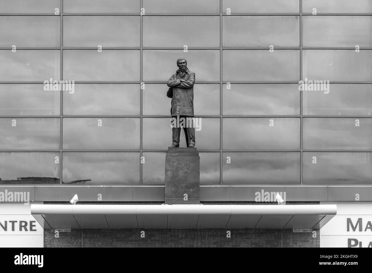 Old trafford football stadium and statue of alex ferguson Black and White Stock Photos & Images