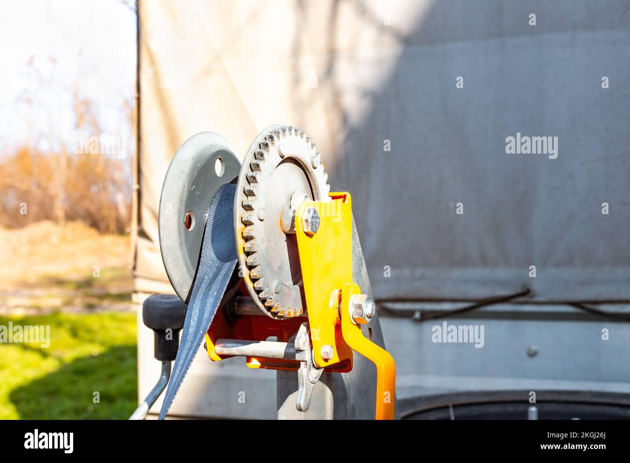 Towing winch on a trailer. Transportation and movement of vehicles. Stock Photo
