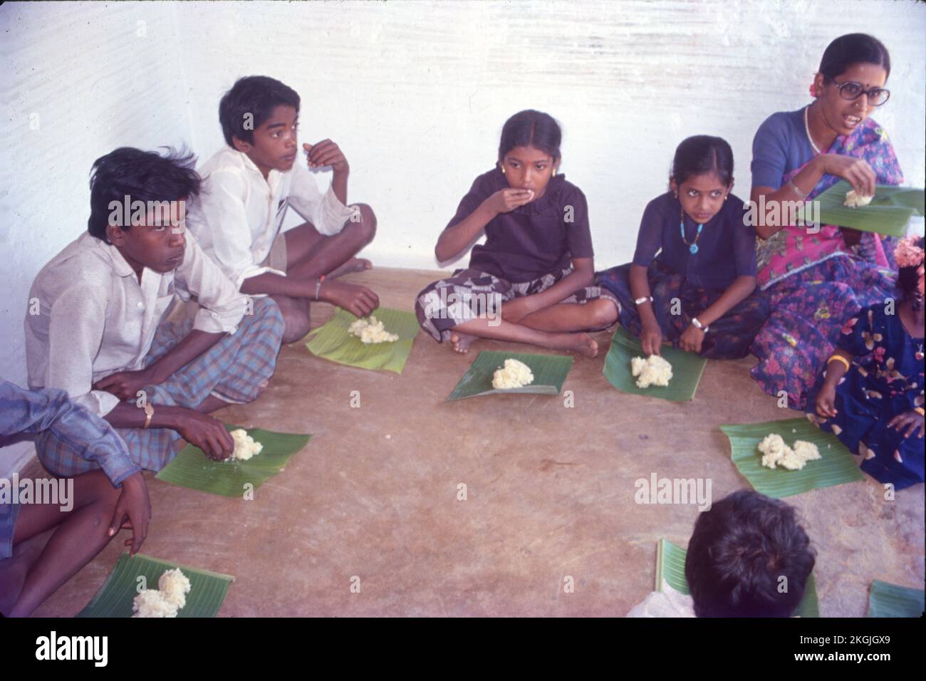 Indian family sitting floor eating hi-res stock photography and images ...