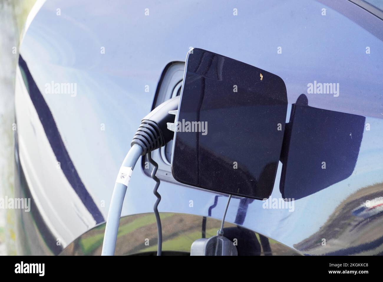 Charging station for electric cars. Charging the electric vehicle at a charging station. Stock Photo