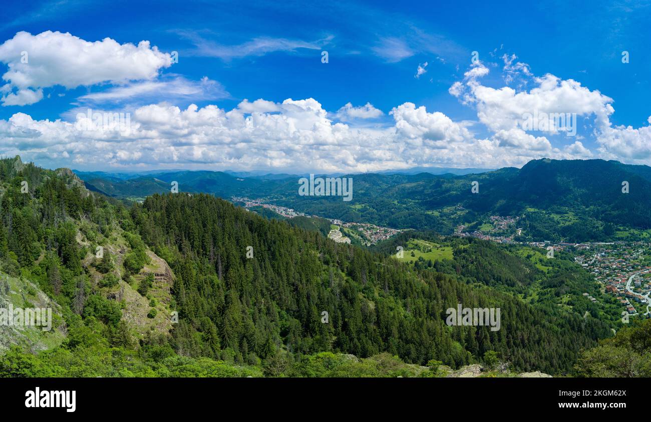 Bulgarian town Smolyan with lake, vegetation and clouds. Rhodope Mountains. Panorama, top view Stock Photo