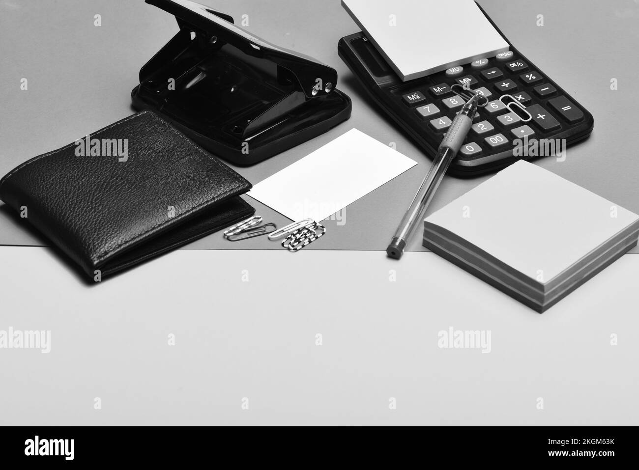 Office tools calculator, hole punch, card, note paper, pen, clips