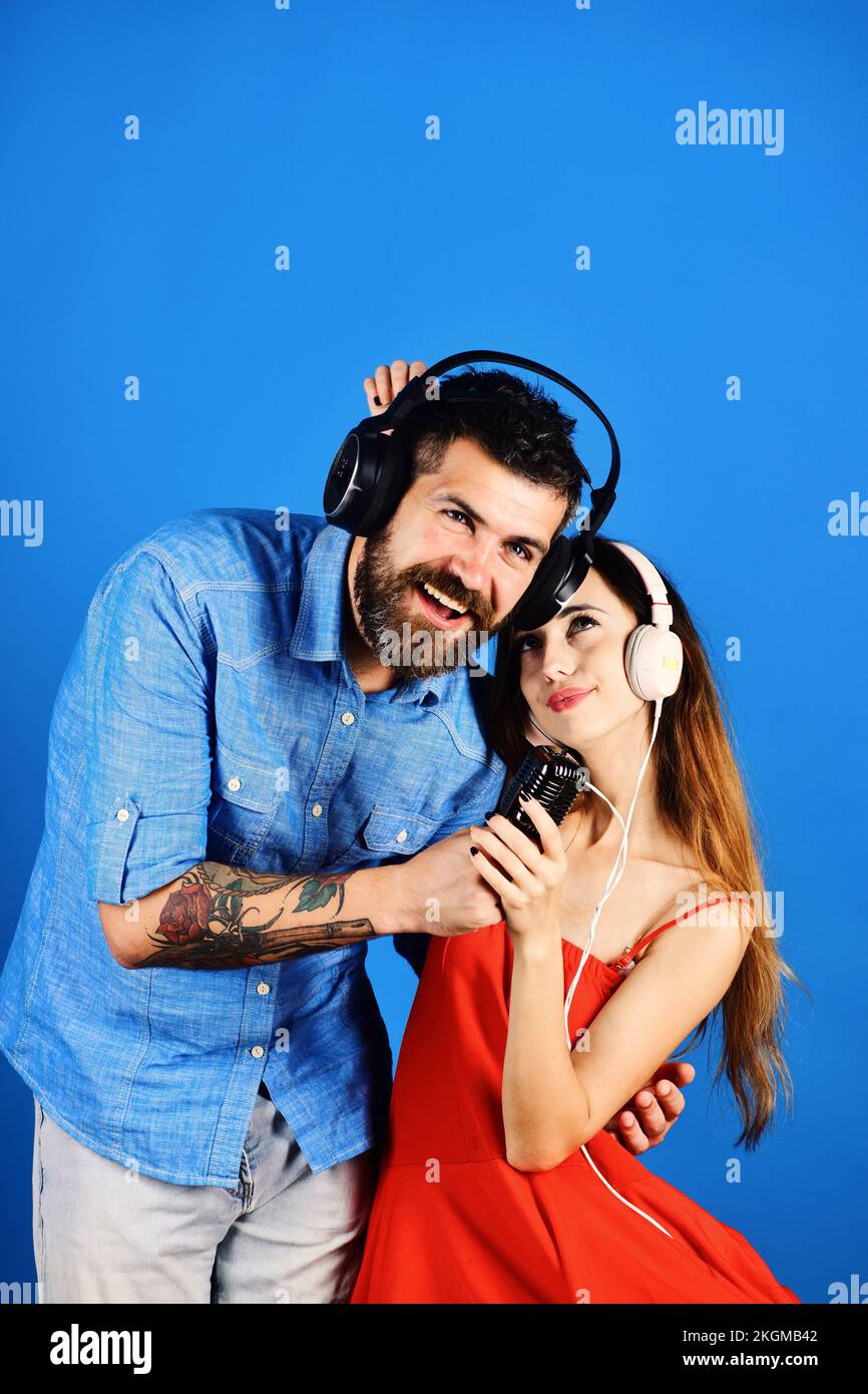 Man with beard and girl hug on blue background Stock Photo - Alamy