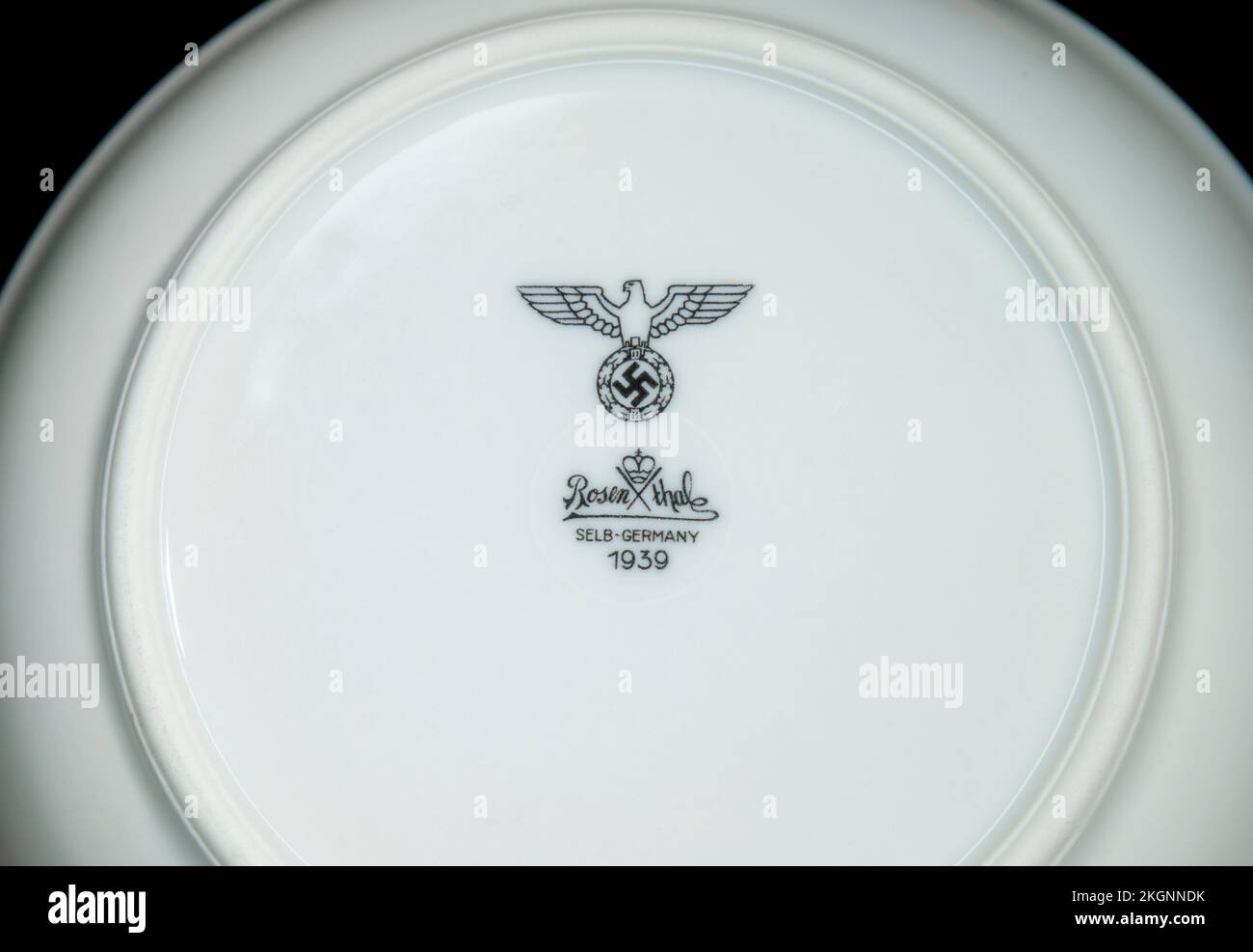 Plate of white china with German imperial eagle and swastika above the