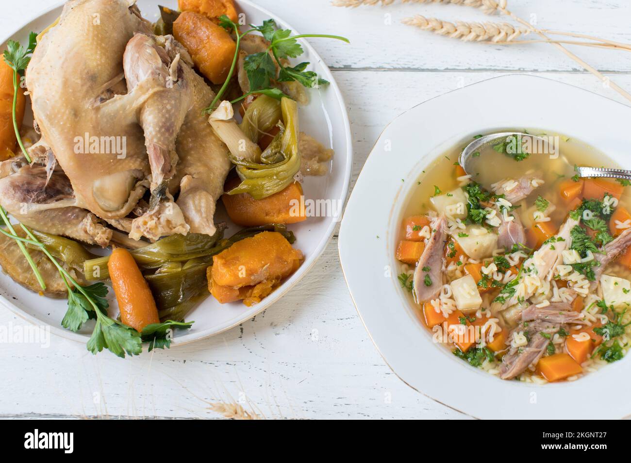 Plate with fresh cooked chicken soup with Alphabet Pasta and boiled hen