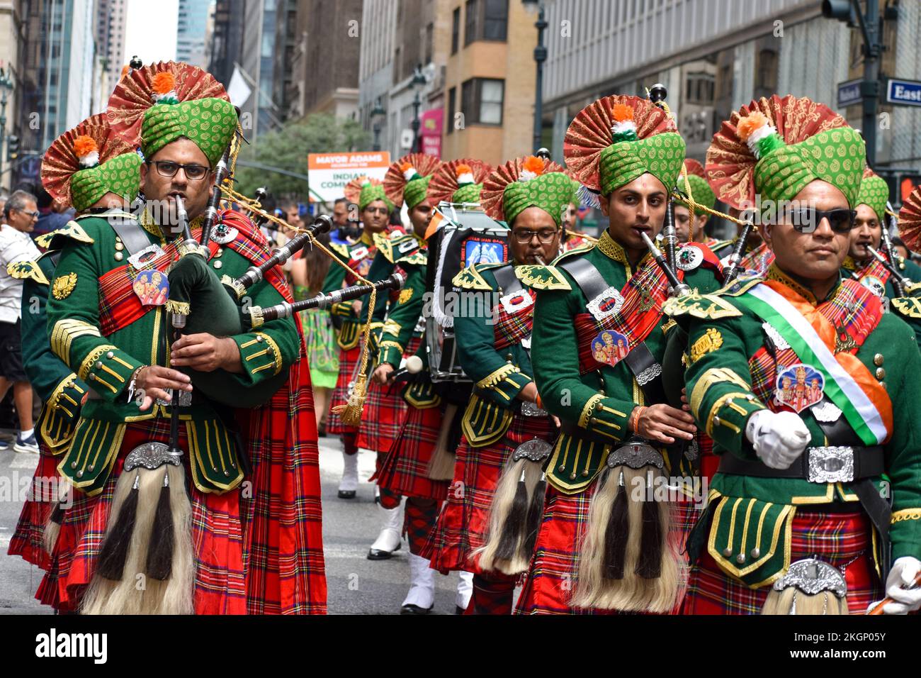 People in traditional Scottish clothing in the streets of New York