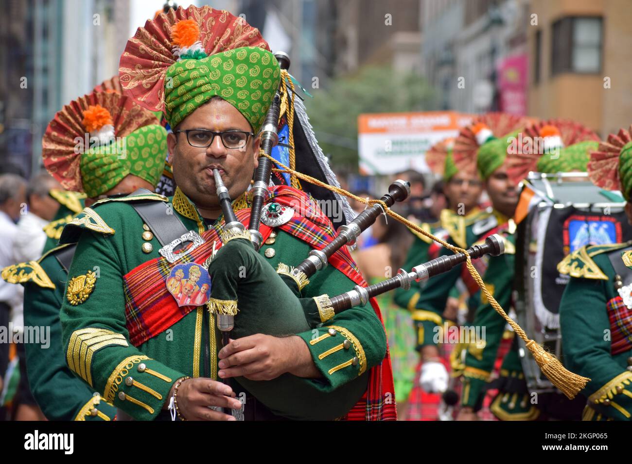People in traditional Scottish clothing in the streets of New York