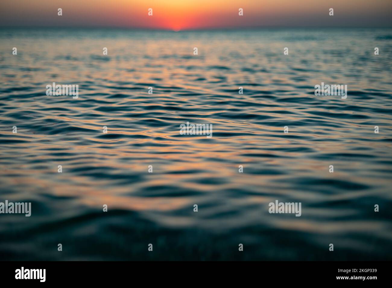 Close up of sea surface on sunset. Water background Stock Photo - Alamy