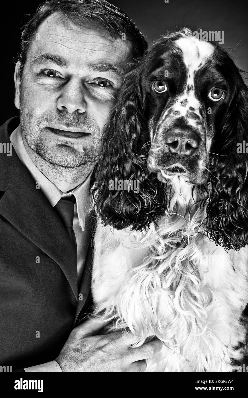 Portrait of mature man with English Springer Spaniel Stock Photo