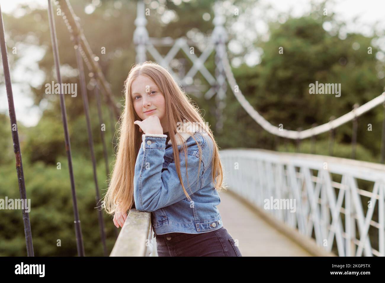 Portrait of teenage girl on a bridge Stock Photo
