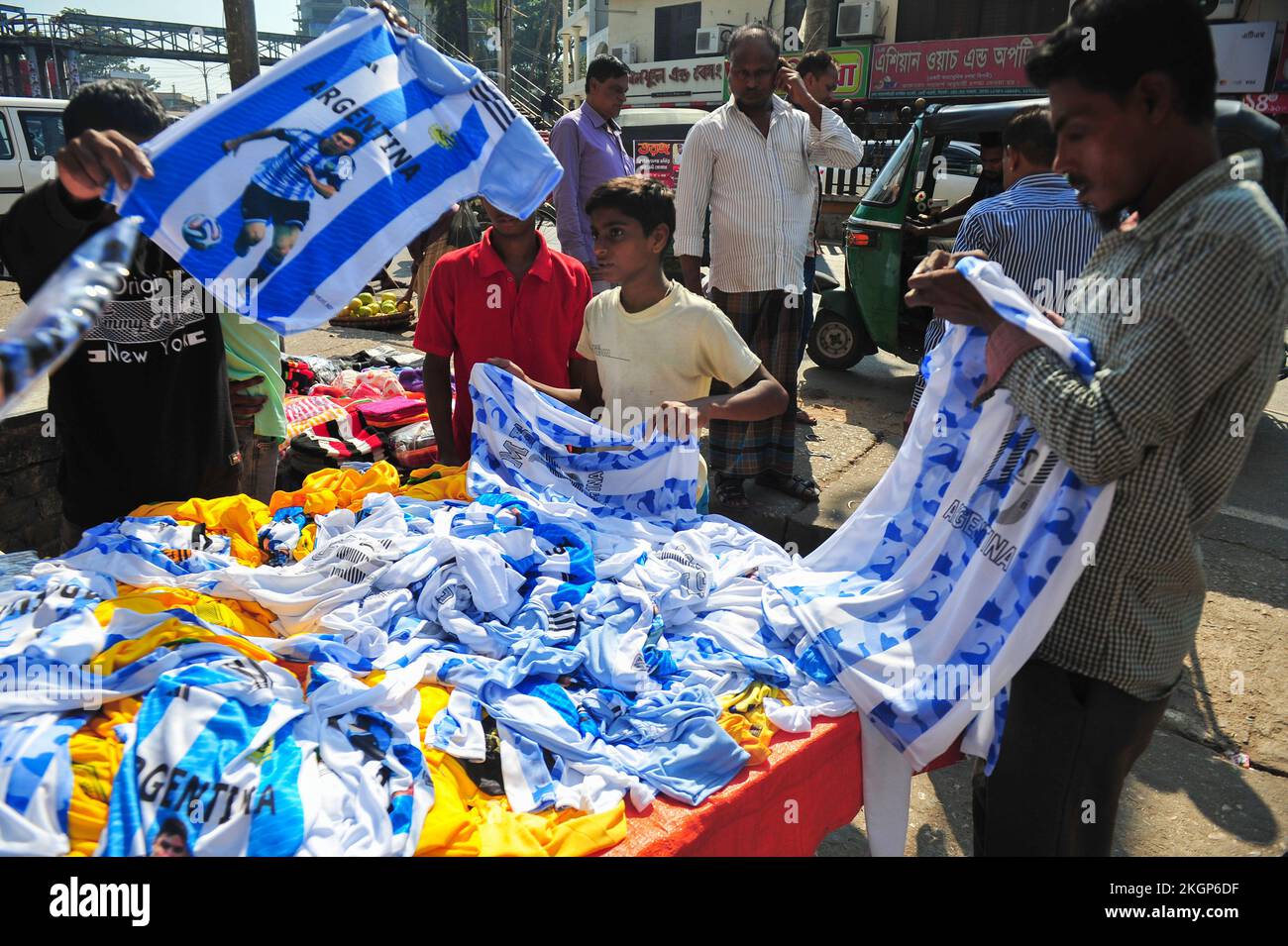 Nov 22, 2022, Sylhet, Bangladesh Fans buying jersey and Flags of their favorite football team at outside market during the FIFA World Cup 2022, todays match between Argentina vs Saudi Arabia .