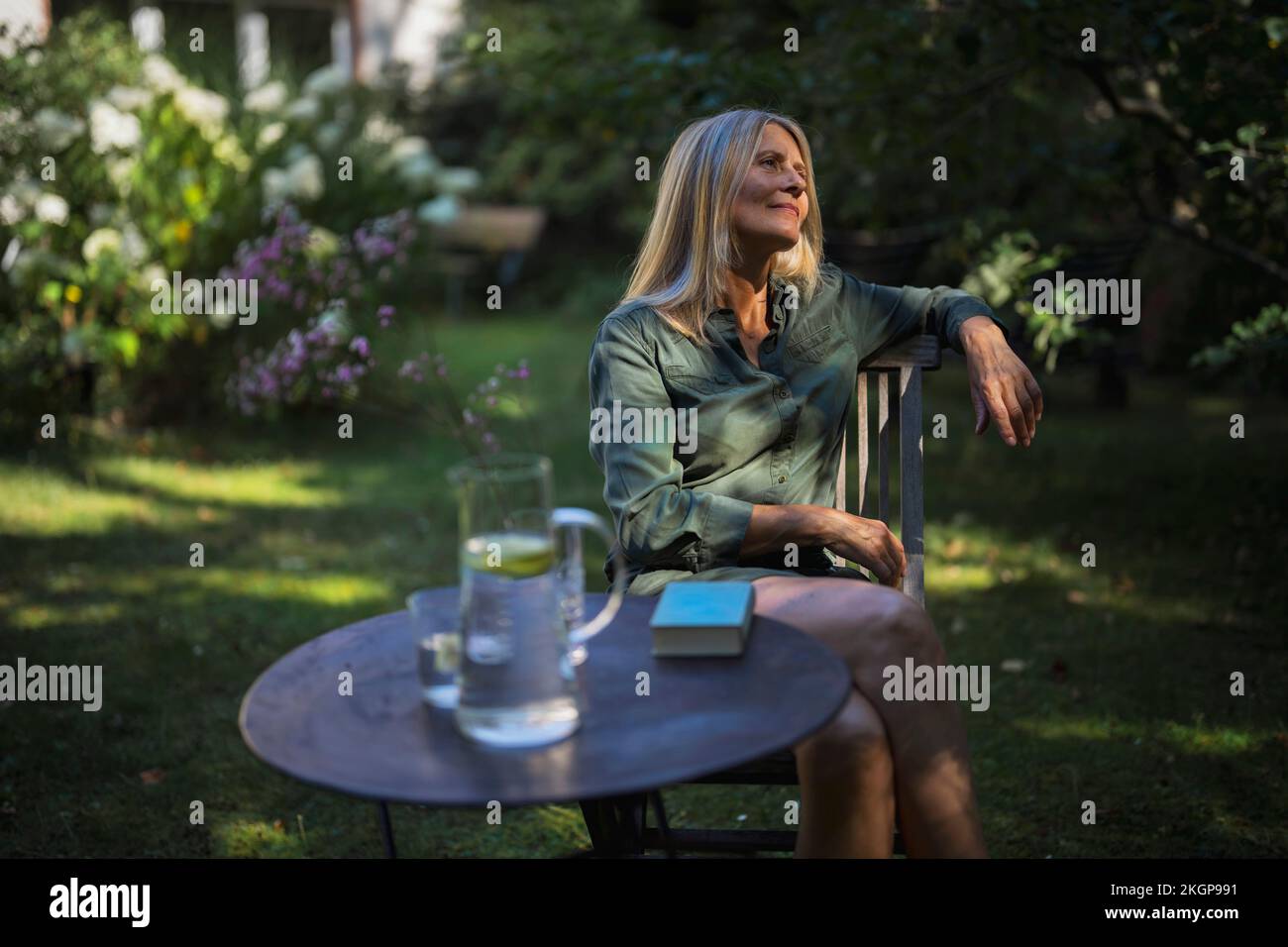 Woman wellbeing garden chair hi-res stock photography and images - Alamy