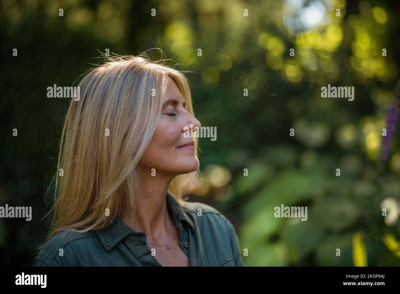 Mature Woman With Blond Hair With Eyes Closed In Garden Stock Photo Alamy 3-592-gorgeous-mature-blonde-stock-photos-free-royalty-free-stock