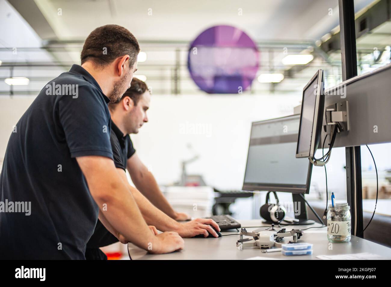 Professional worker printmaker technician operator works in printing