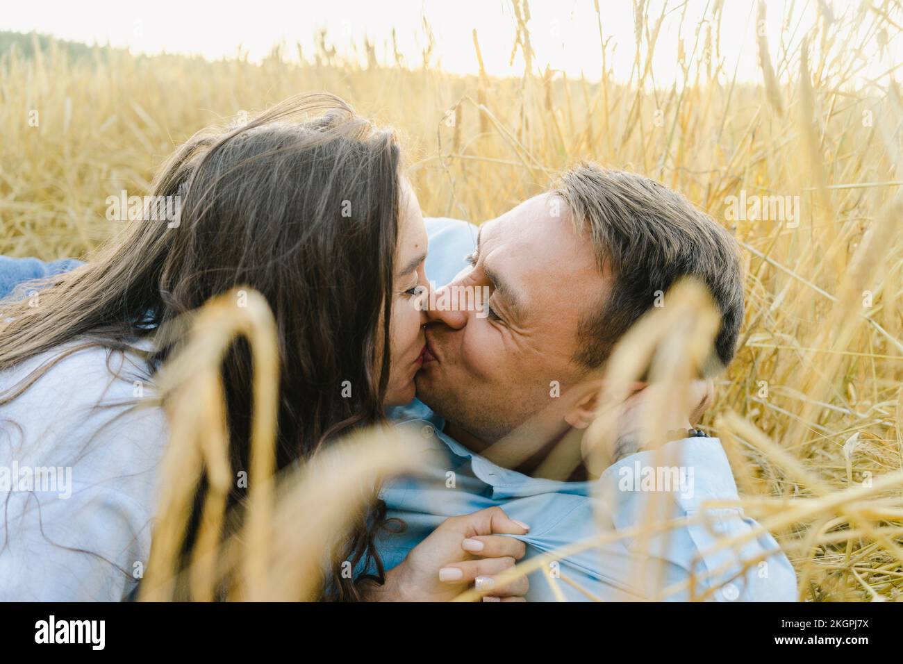 Couple in love kissing lying hi-res stock photography and images - Alamy