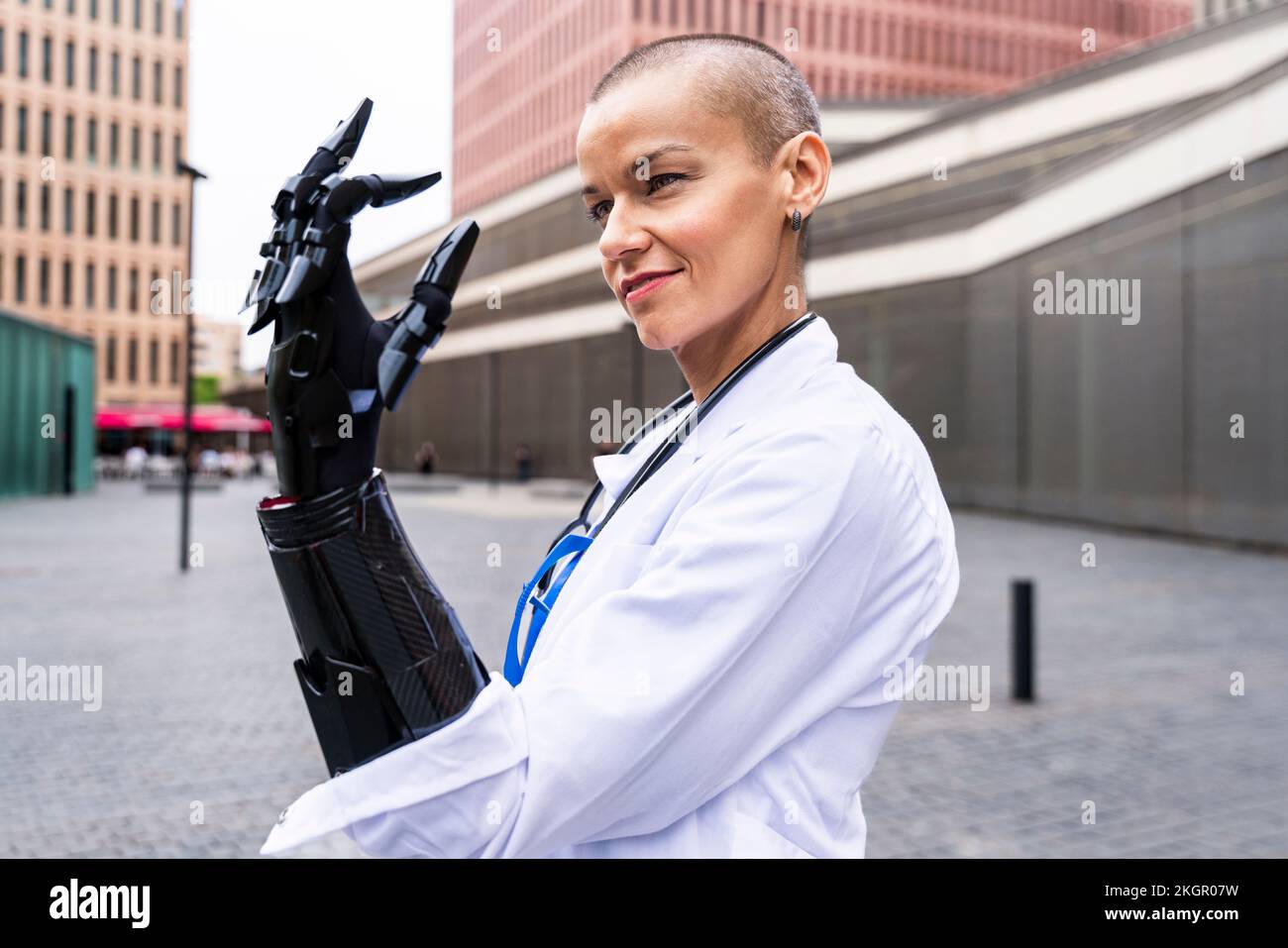 Smiling healthcare worker looking at prosthetic equipment Stock Photo