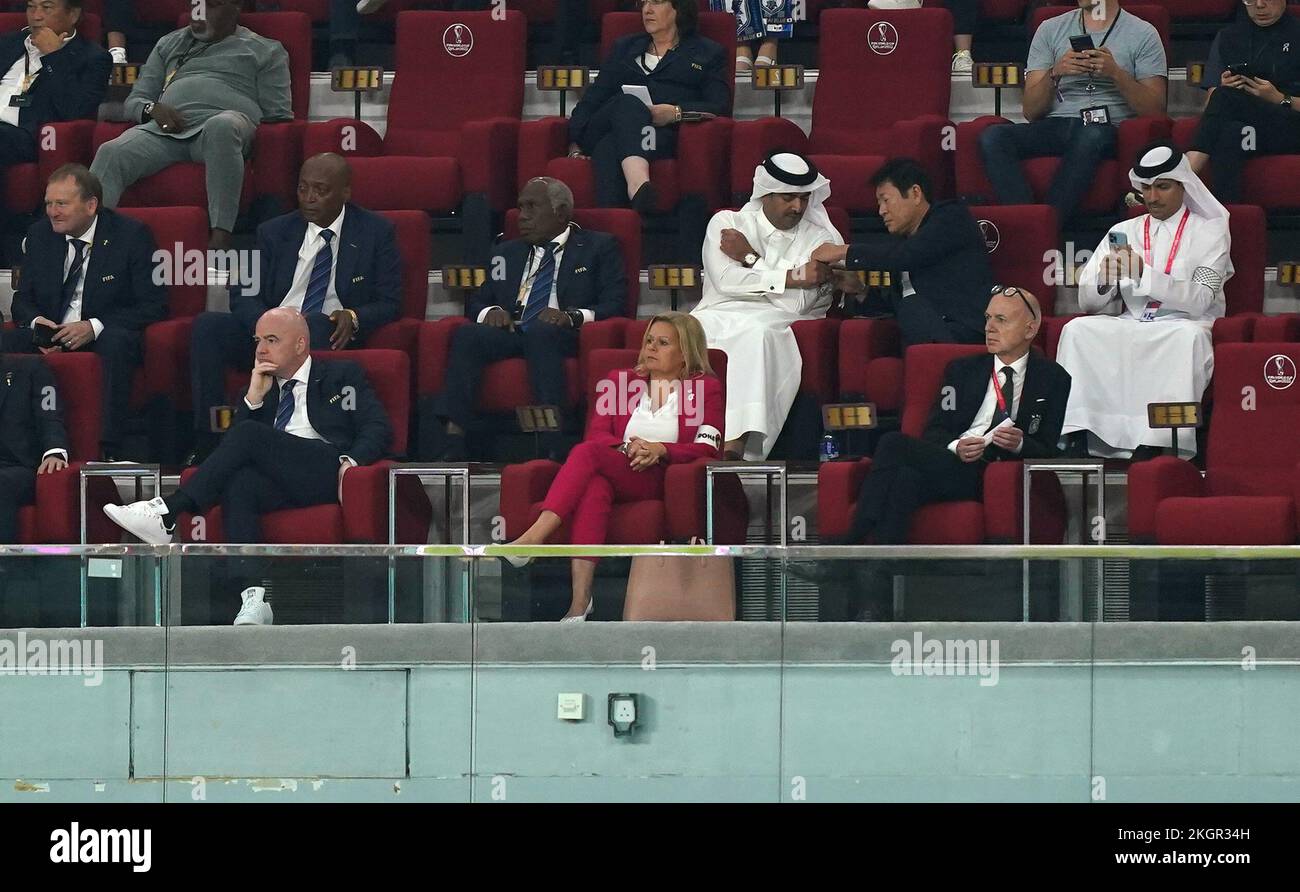 FIFA President, Gianni Infantino (left), German Football Federation (DFB) President Bernd Neuendorf (right) sit alongside German Interior Minister Nancy Faeser (centre) who is wearing the One Love armband as they watch from the stands, during the FIFA World Cup Group E match at the Khalifa International Stadium, Doha. Picture date: Wednesday November 23, 2022. Stock Photo
