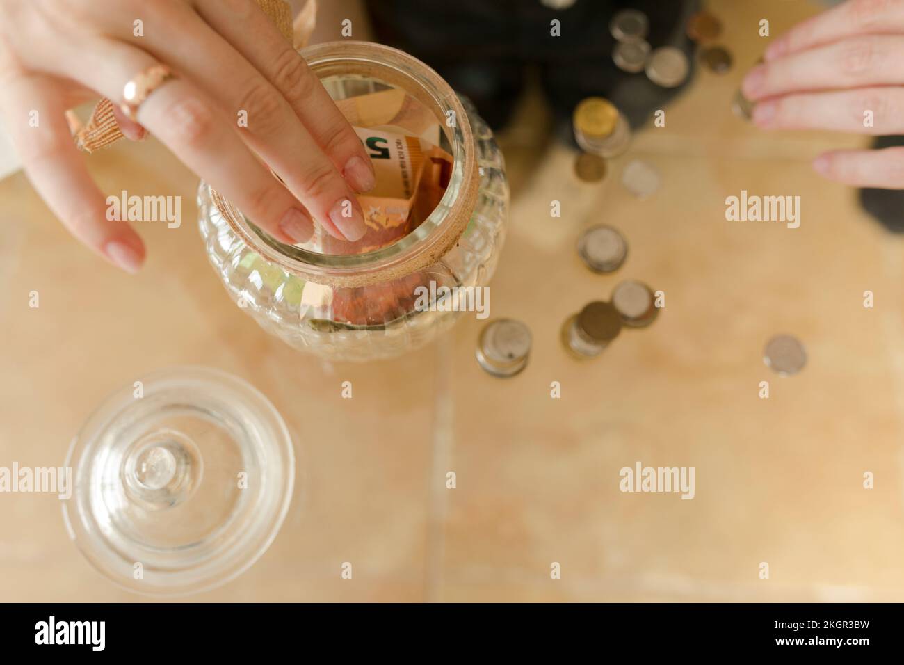 Hand of man and woman counting currency on table at home Stock Photo ...