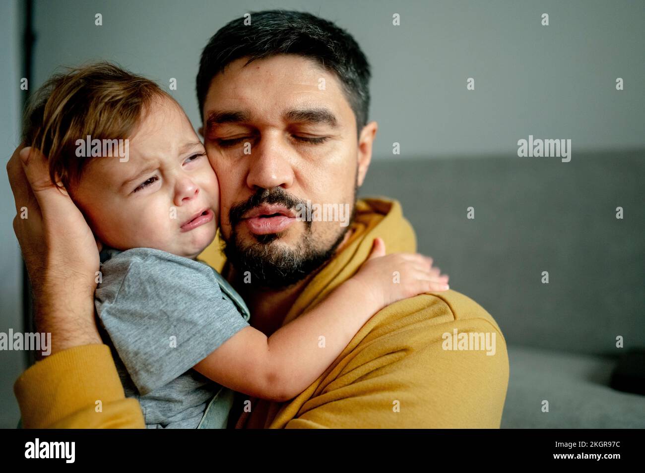 Father son hugging in living hi-res stock photography and images - Alamy