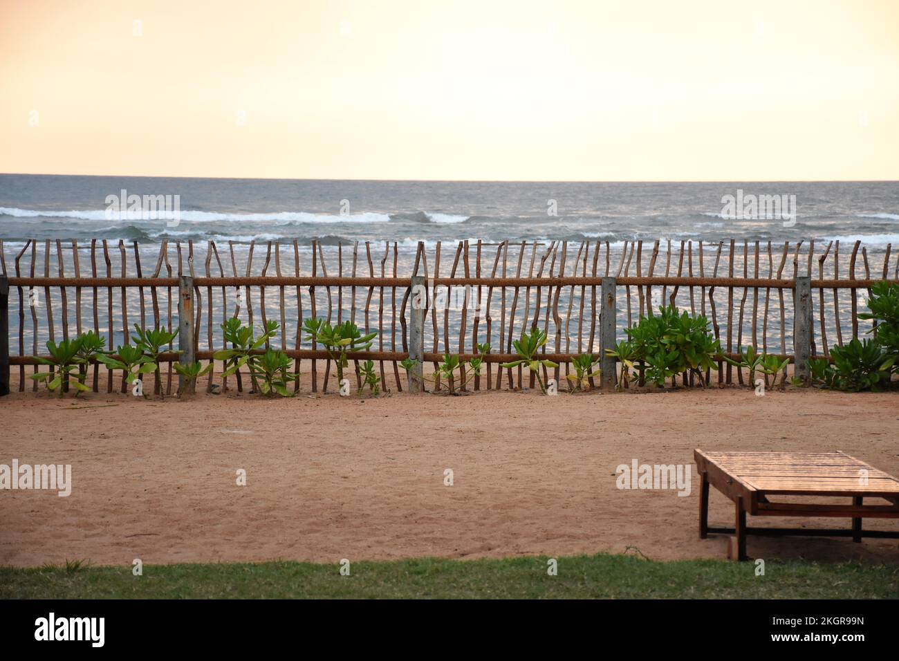 A beautiful shot of a wooden fence on a sandy coast Stock Photo - Alamy