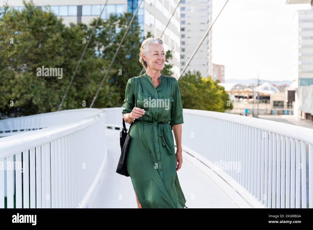 Beautiful mature woman walking hi-res stock photography and images - Alamy