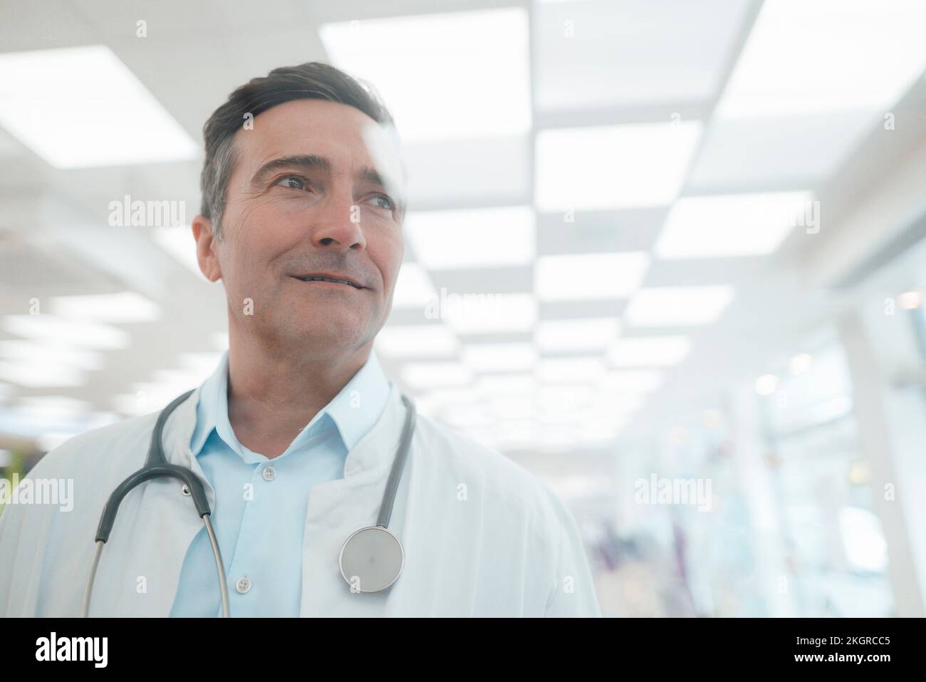 Smiling mature caucasian doctor hi-res stock photography and images - Alamy