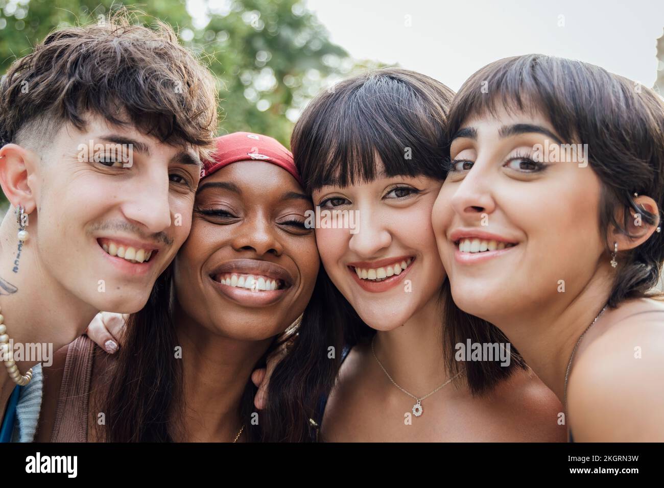 Happy friends with cheek to cheek Stock Photo - Alamy