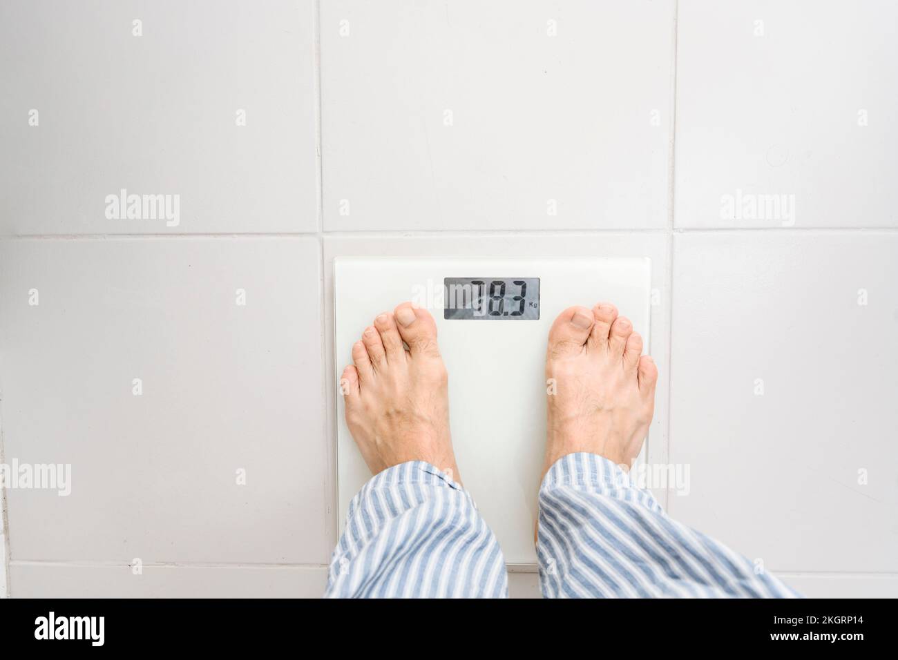 Man Standing On Weighing Scales Photograph by Science Photo Library - Pixels