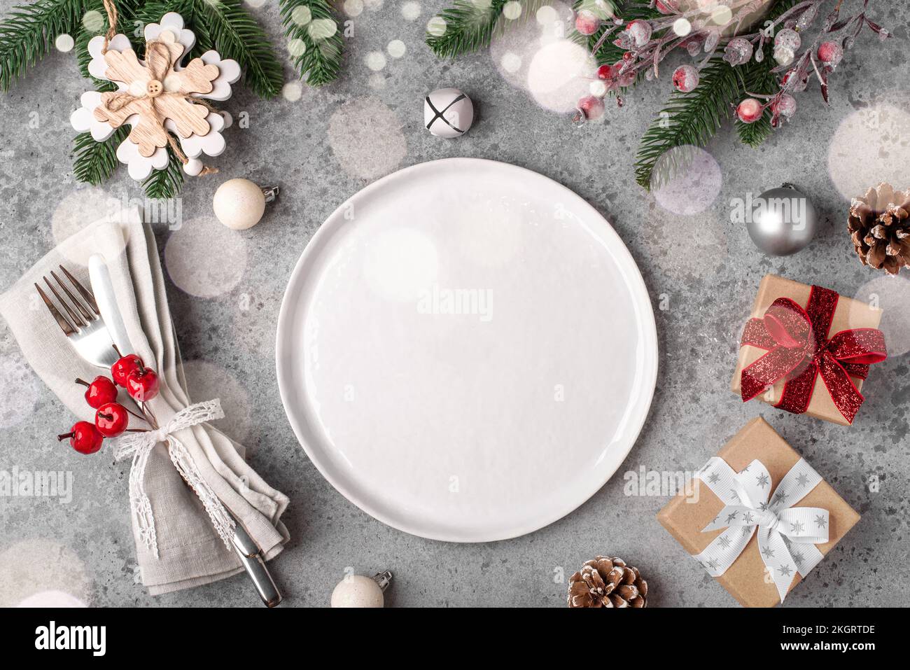 Christmas place setting on gray table. Stock Photo