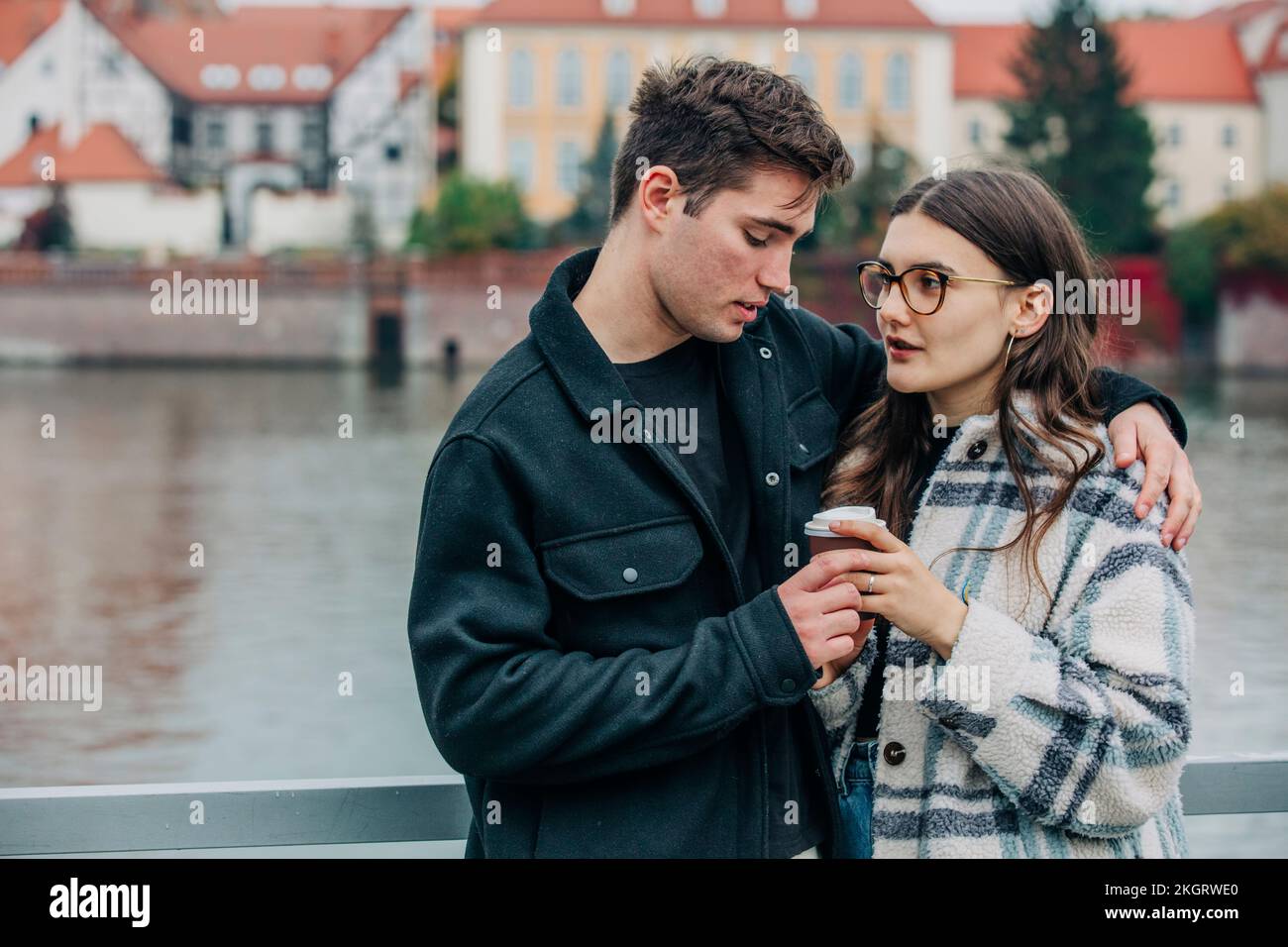 Couple on riverside railing hi-res stock photography and images - Alamy