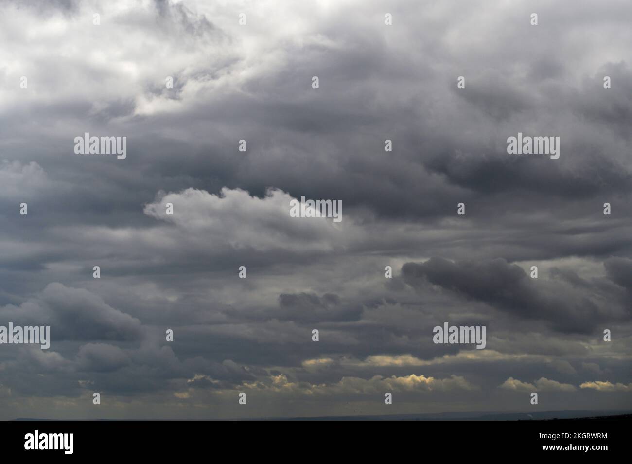 Dark clouds in a stormy sky. Stock Photo