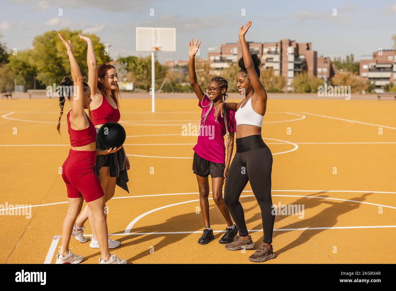 Four young women standing hi-res stock photography and images - Alamy