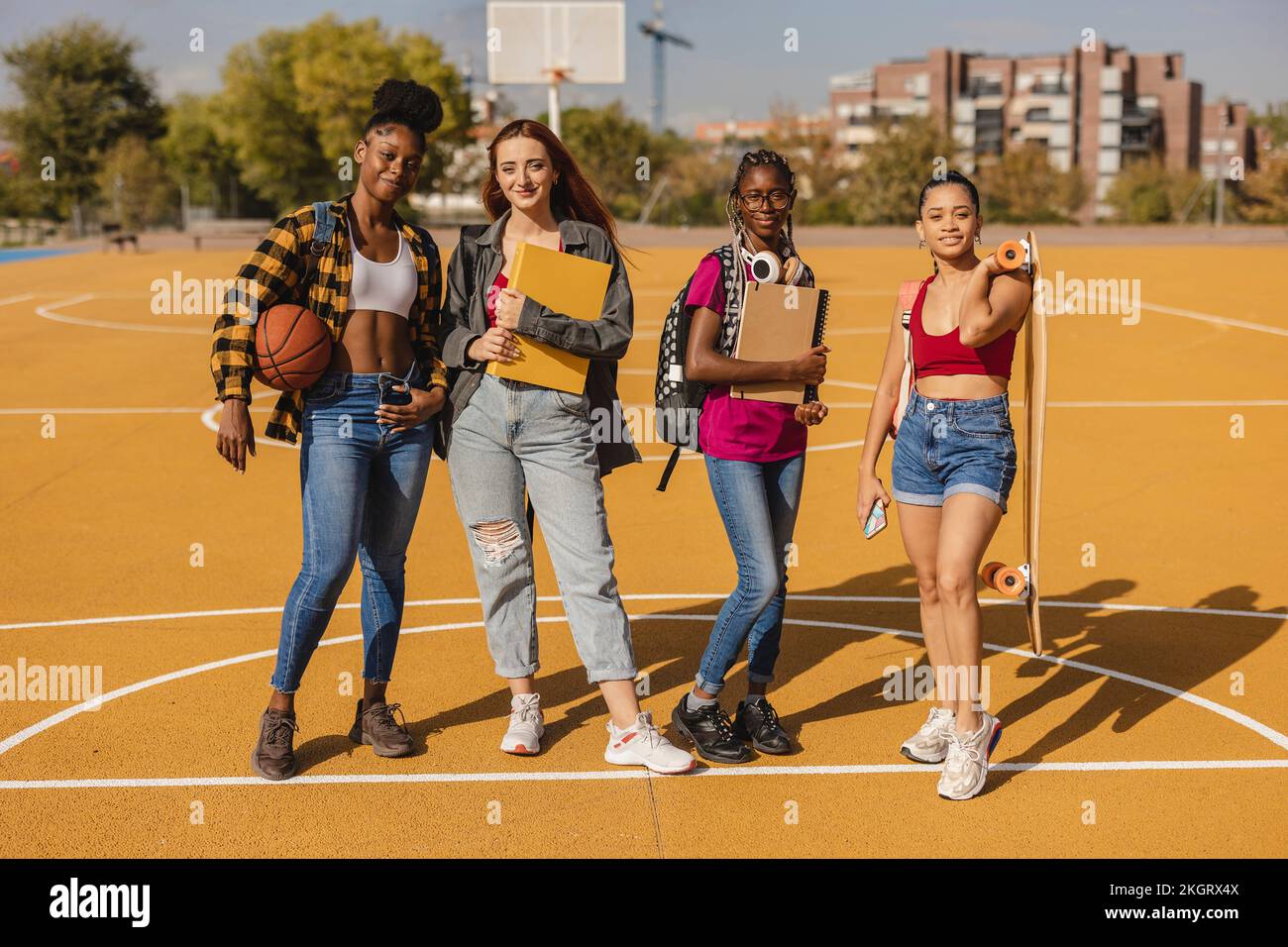 Young woman holding basketball in hi-res stock photography and images ...