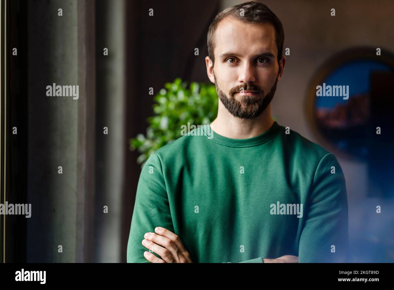 Confident young businessman at workplace Stock Photo