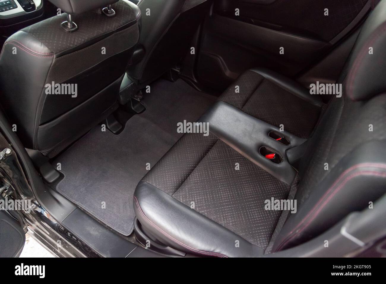 Clean after washing the rear passenger seats of leather and fabric trim