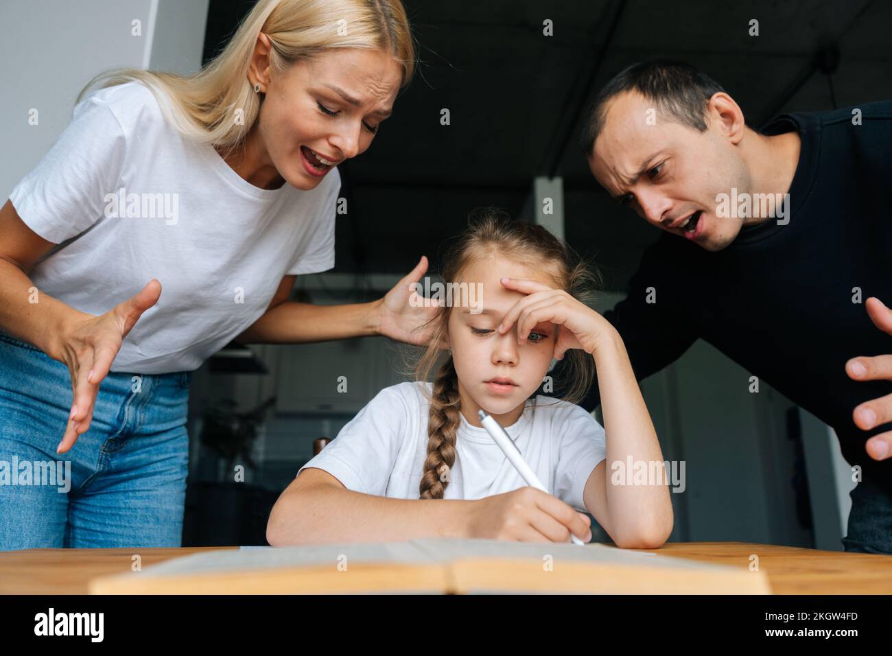 Full length portrait of an angry mother shouting at her daughter isolated  on white background Stock Photo - Alamy