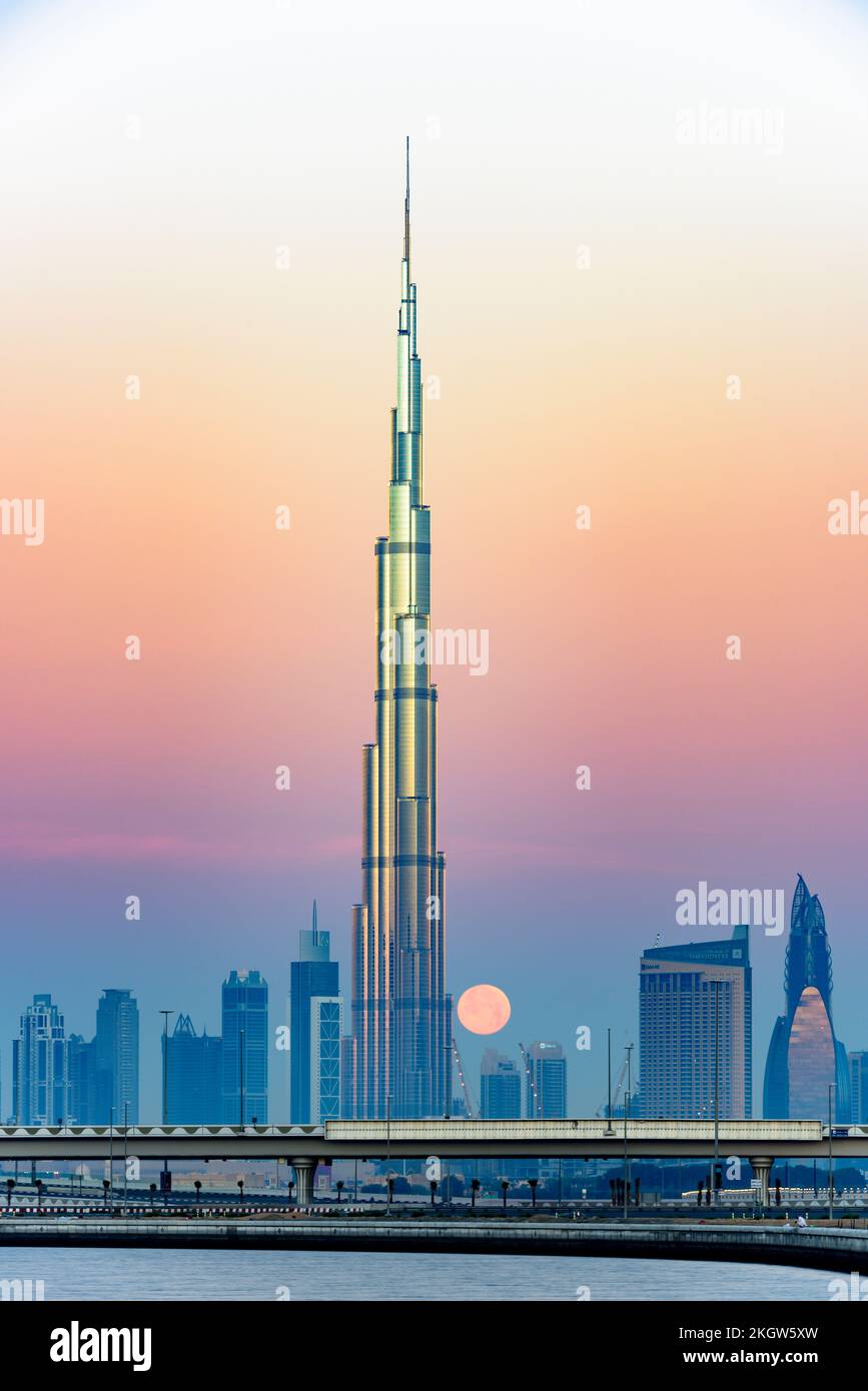 Dubai, United Arab Emirates, April 22nd, 2016. Burj Al Arab and full moon early morning, vertical picture with vibrant colours Stock Photo