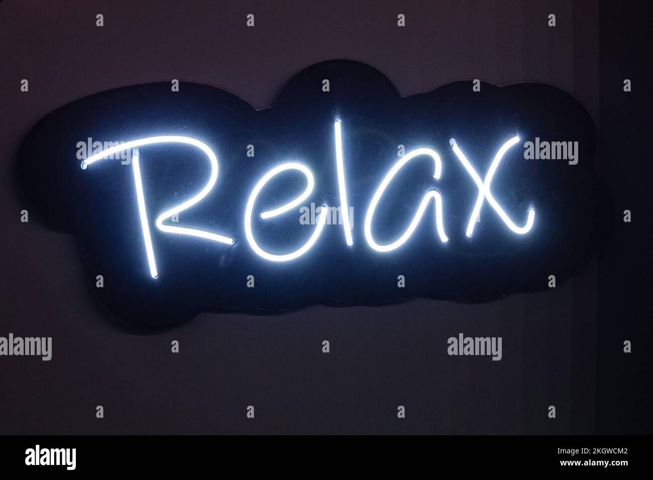 White Neon Sign Relax at Black Wall Concept Stock Photo Alamy