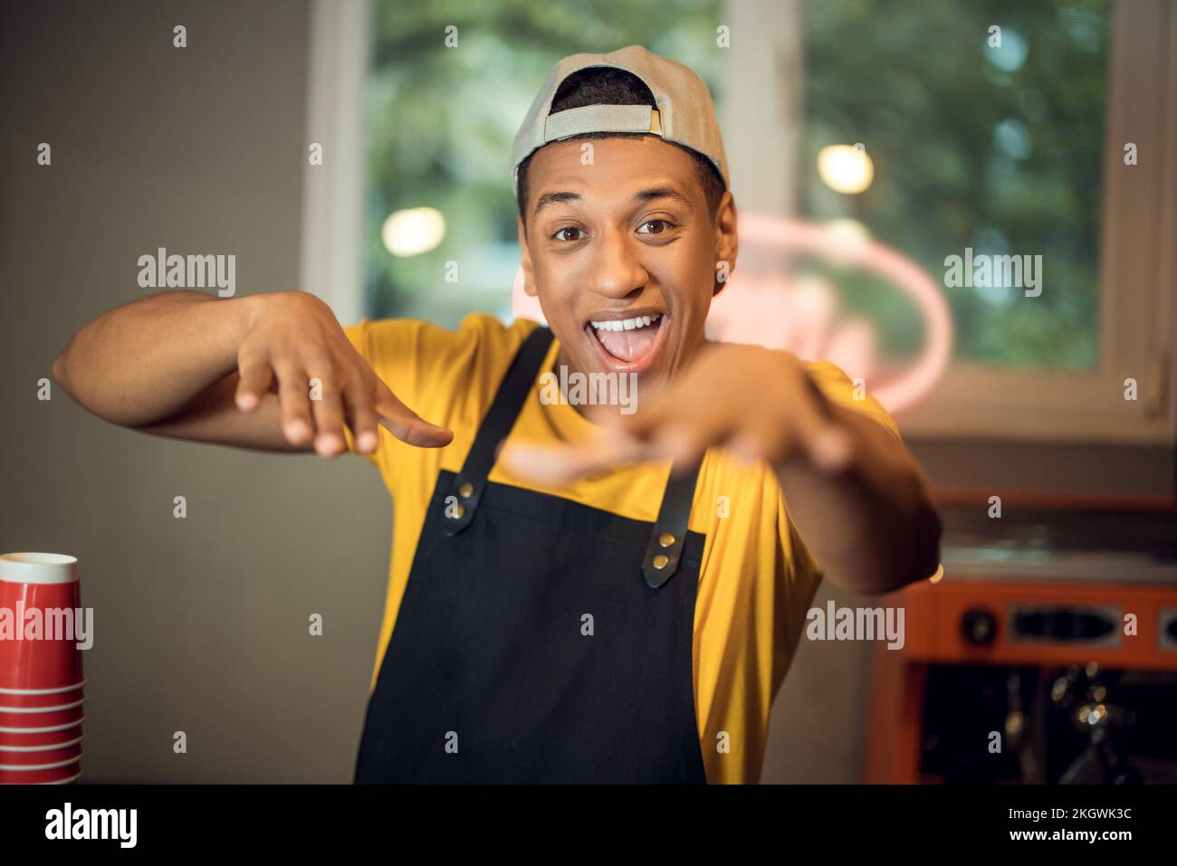 Happy cafe worker having fun in the workplace stock photo alamy