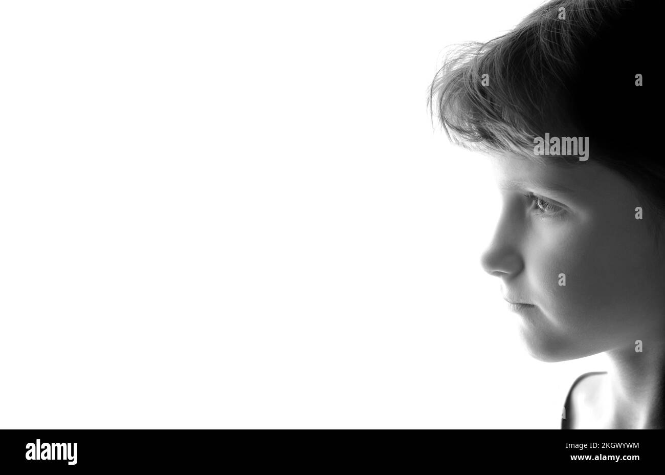 Young girl portrait isolated on white background profile highkey or