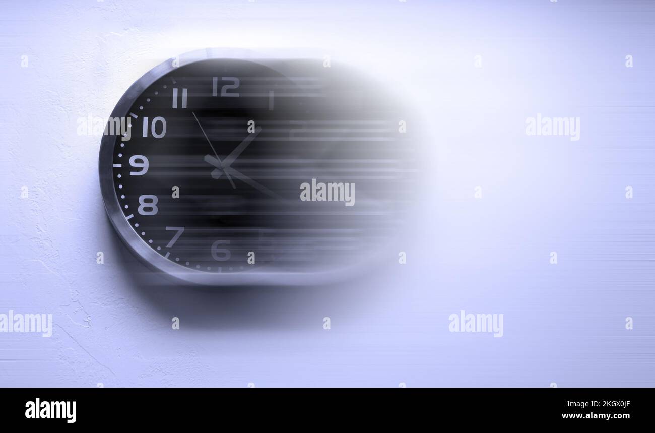 Detail of clock face with numbers and hands showing time with clock in