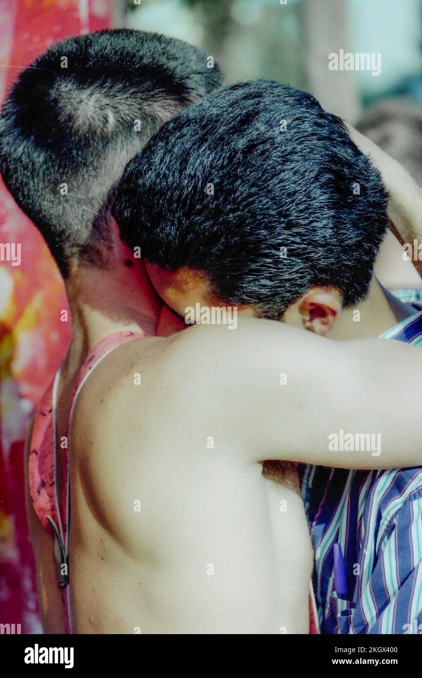 Two young men in intimate embrace at the third Christopher Street Day, CSD in 1992 in Berlin. Stock Photo