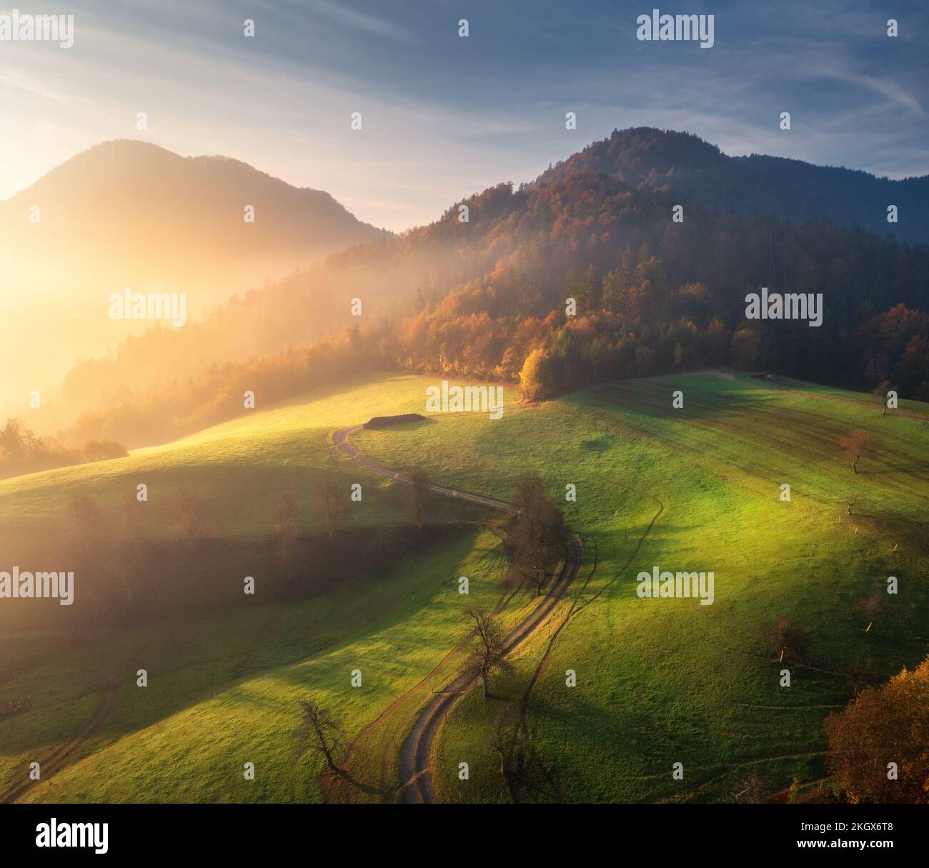 Aerial view of beautiful green hills and mountains in fog Stock Photo