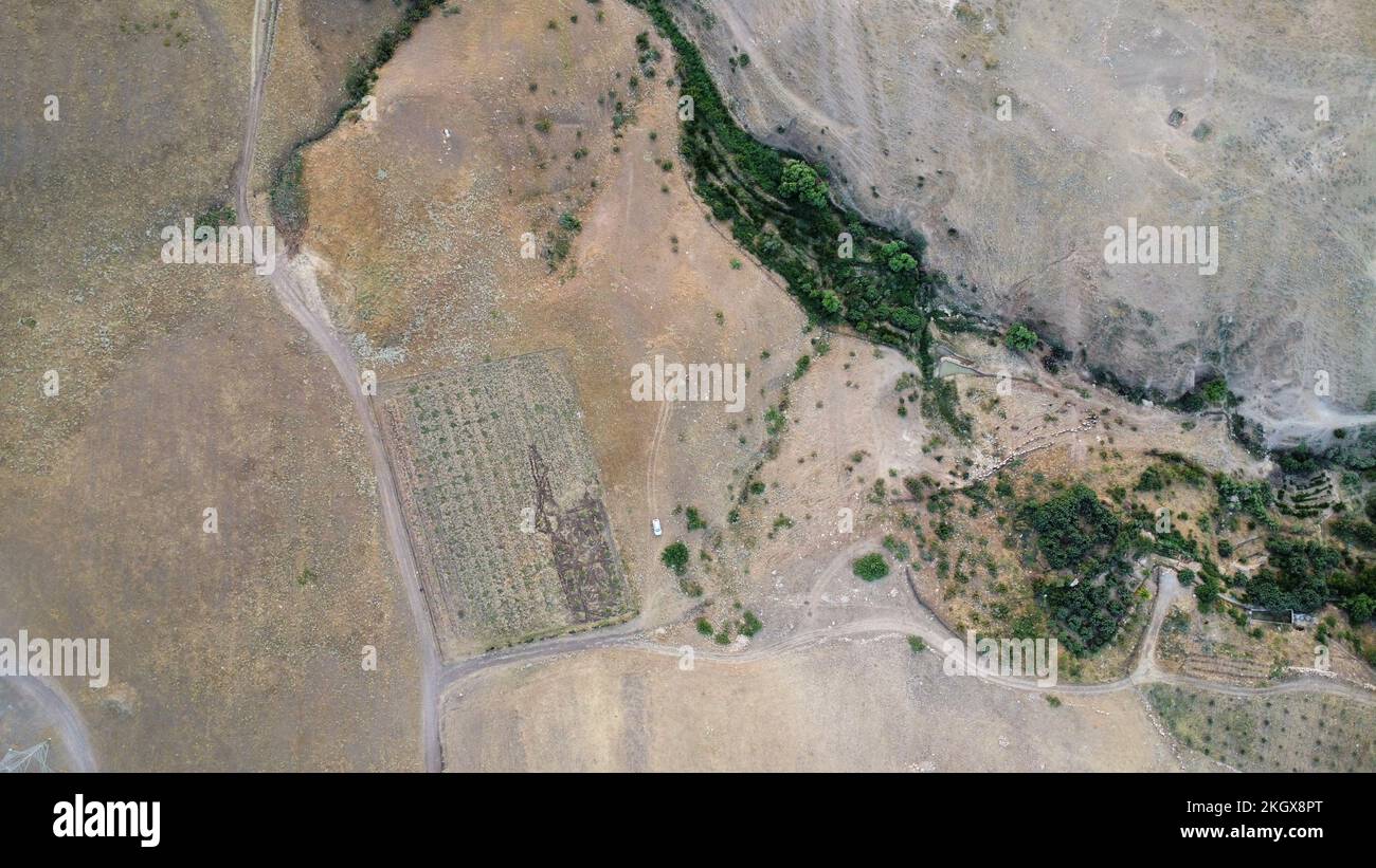 Satelite View Rural Area An aerial view of a rural village area with mountains and trees Stock ...