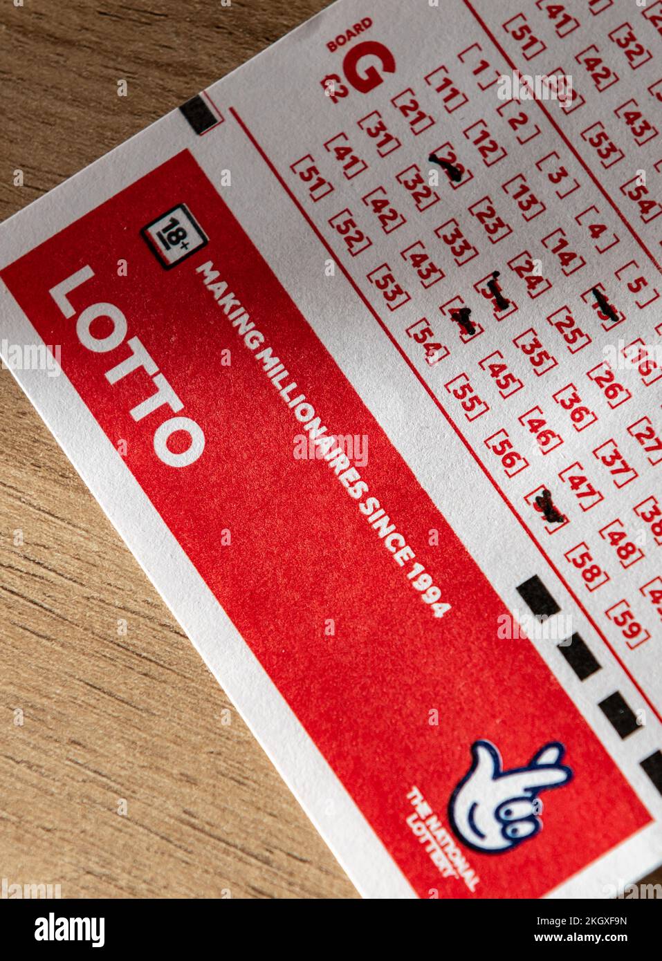 London. UK- 11.20.2022. A close up of a lottery coupon showing the lotto name and National Lottery trademark. Stock Photo