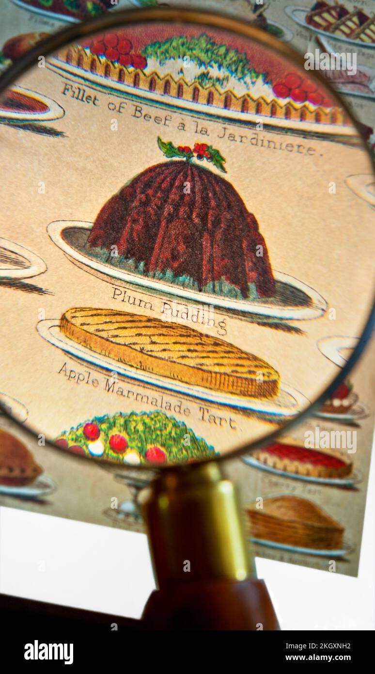 CHRISTMAS PUDDING retro vintage Victorian book page. Magnifying glass on Victorian Mrs Beeton's Cookery Book lithograph, dishes including Christmas Plum pudding & Apple Marmalade tart 1890’s Stock Photo
