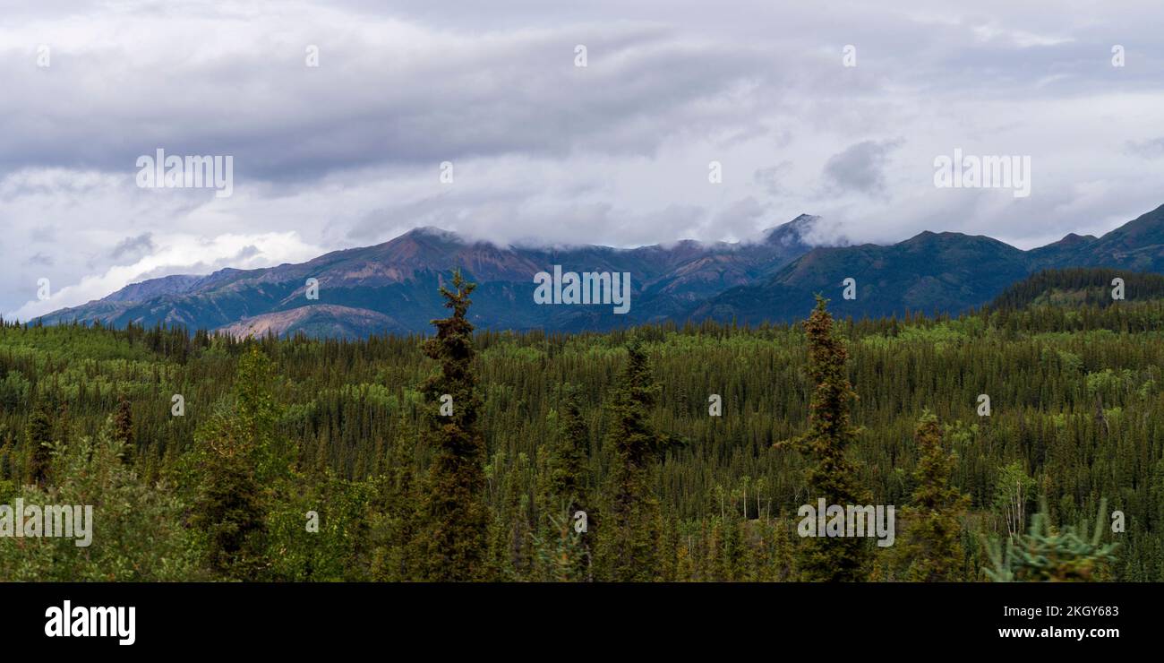 A scenic shot of the Alaska Range in the Southcentral region of Alaska, USA under a cloudy sky Stock Photo