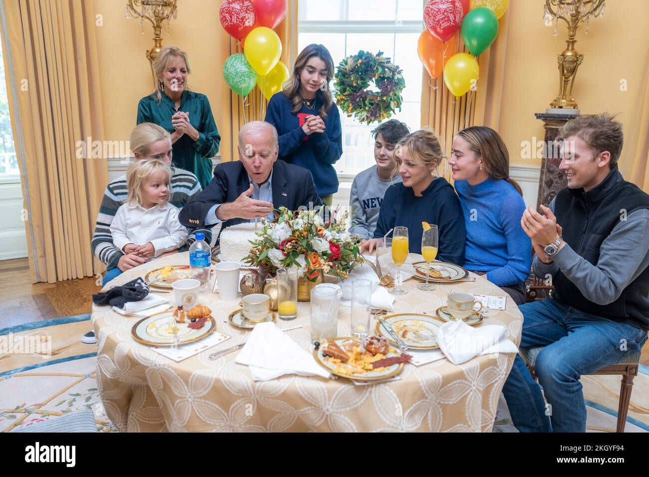 Washington, United States. 20 November, 2022. U.S. President Joe Biden blows out a birthday candle along with First Lady Jill Biden and family members as they celebrate the 80th birthday of the president with a brunch in the residence of the White House, November 20, 2022, in Washington, D.C.  Credit: Adam Schultz/White House Photo/Alamy Live News Stock Photo