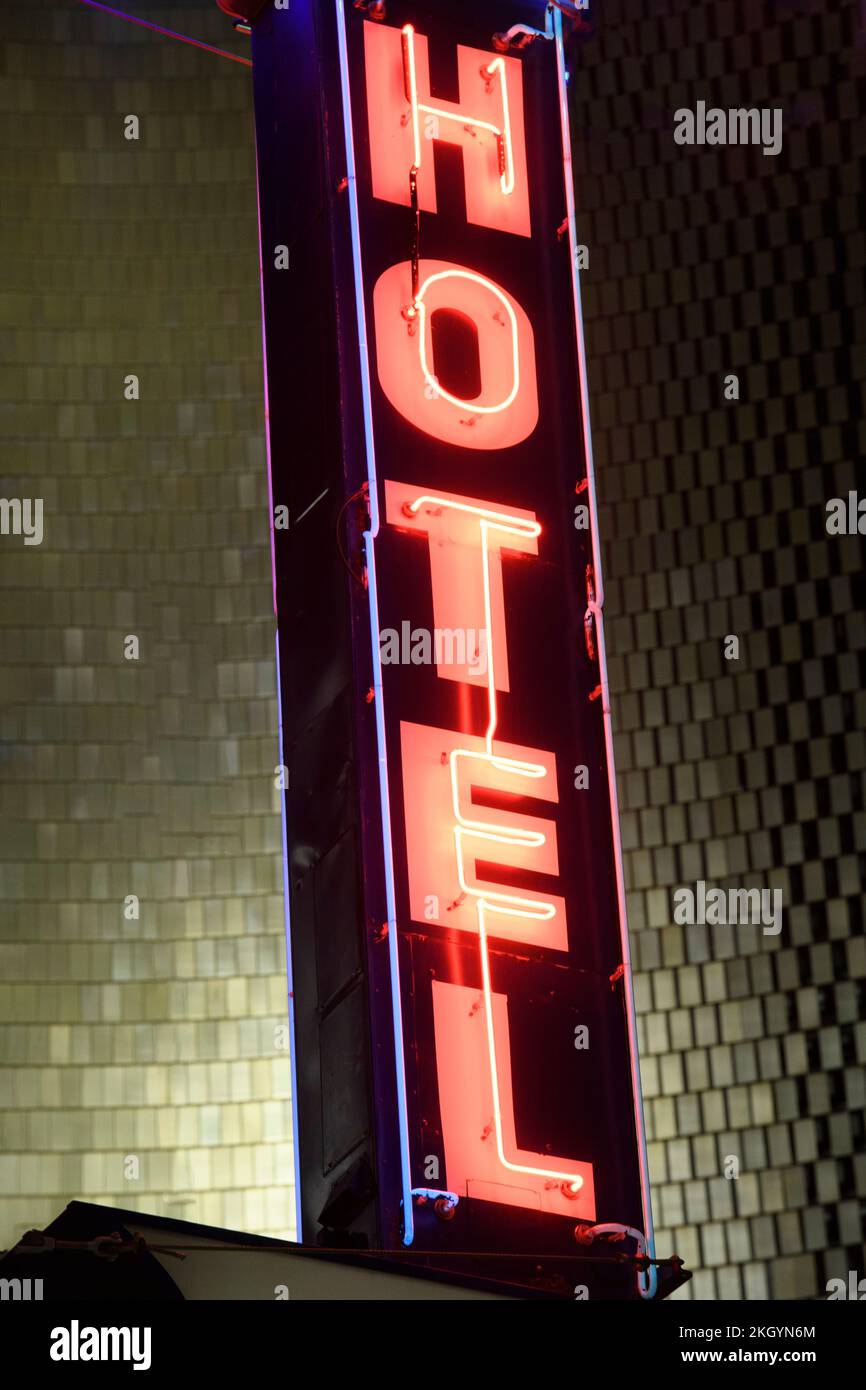 Outdoor neon sign on a vintage hotel Stock Photo